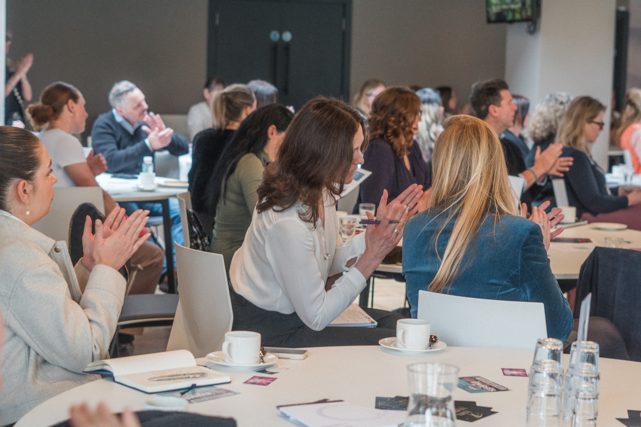 Guests applauding at Wealth Reimagined